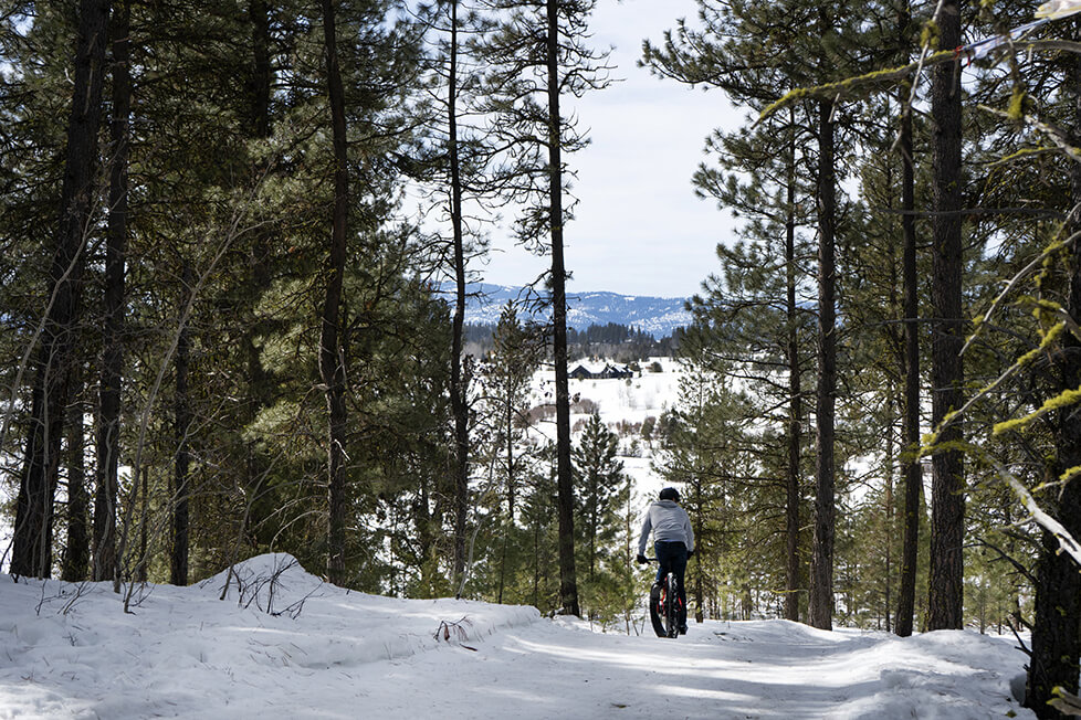 Riley biking in the wilderness - Visit Idaho Weekend Guide